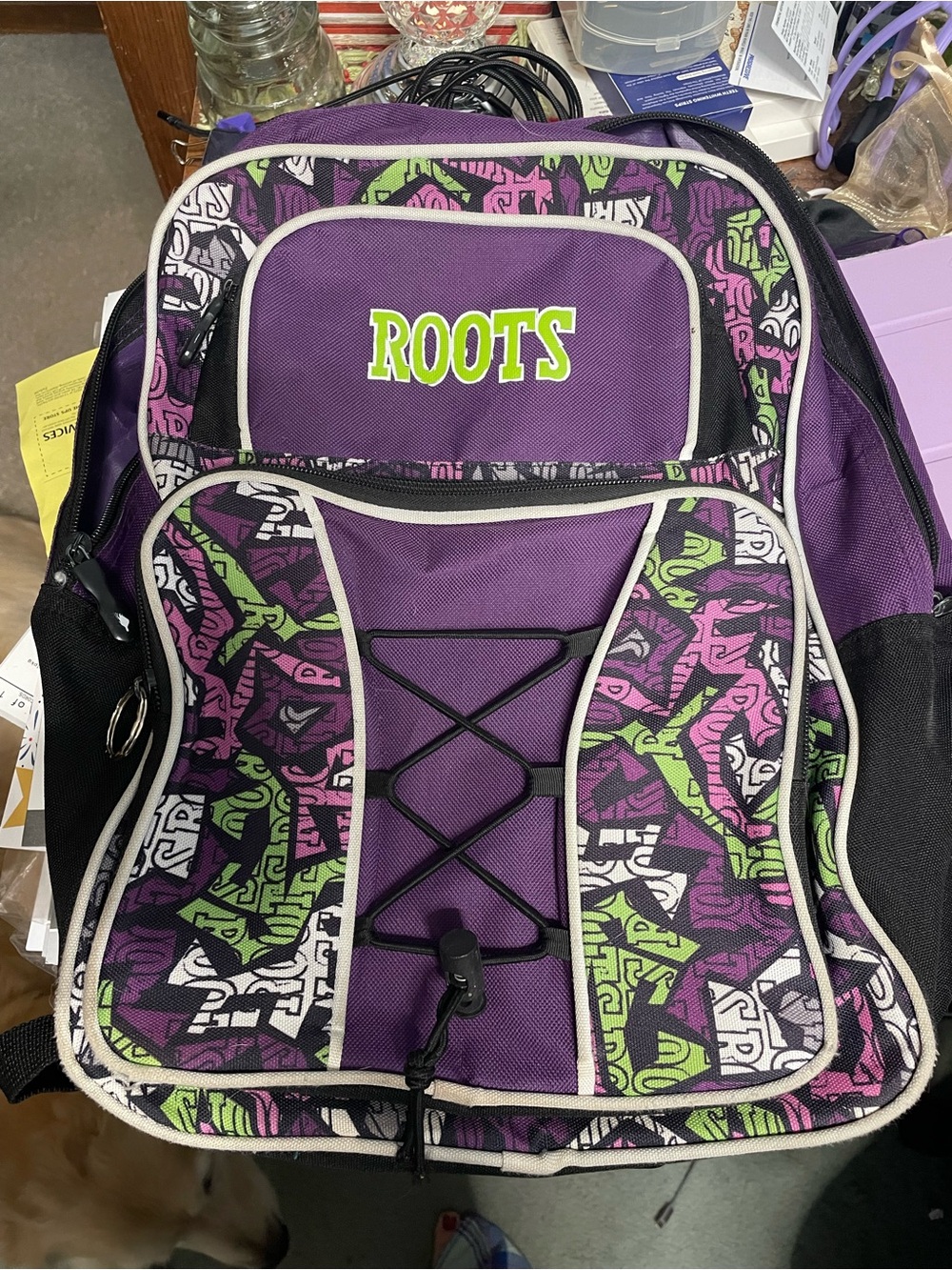 Roots Purple Backpack with Lime and Pink Graphics